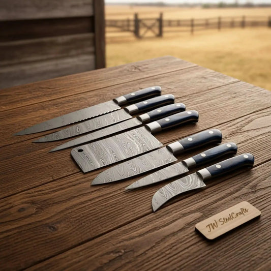 7-Piece Outdoor Damascus Kitchen Knife Set with Meat Cleaver & Serrated Bread Knife — Black Resin Handles, Steel Bolsters & Leather Roll | JW Steel Crafts